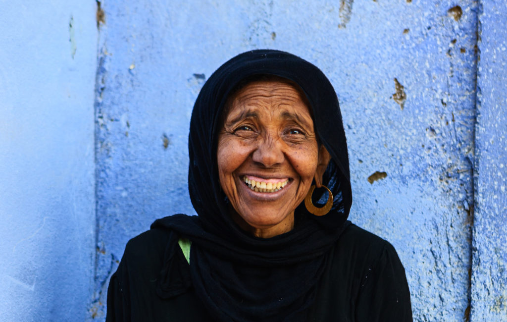 older Muslim woman smiling